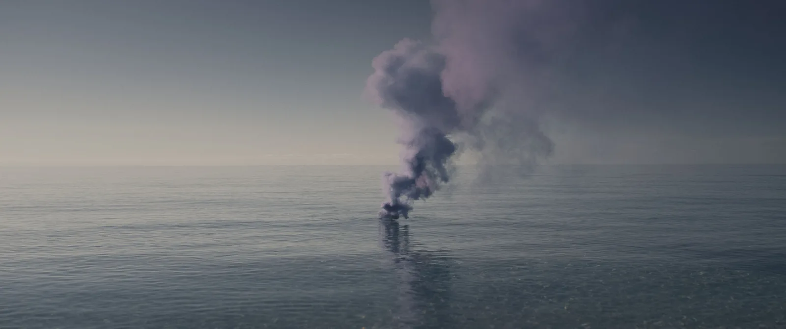 A column of dark smoke rising from a flat calm sea, still from Elisa Giardina Papa's film She Flickered In and Out of History